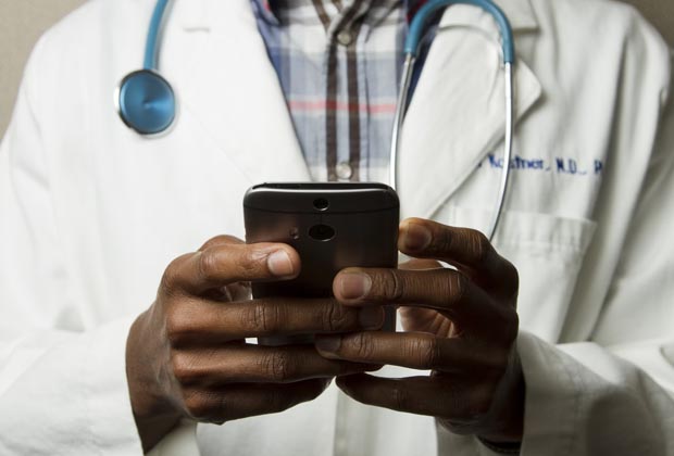 Doctor engaging with a patient via video call, representing the expansion of patient reach through Rousia's provider network.